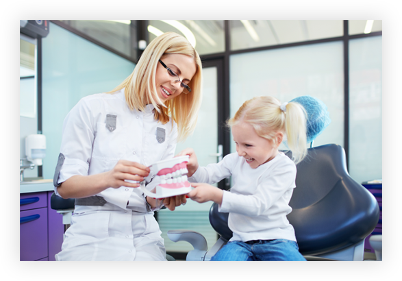 dental care taught to young patient